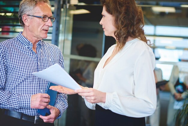 Business woman explaining project to colleague