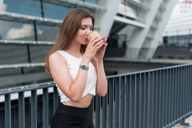 Business woman having a drink