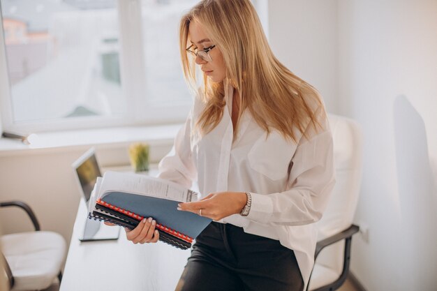 Business woman holding files at office