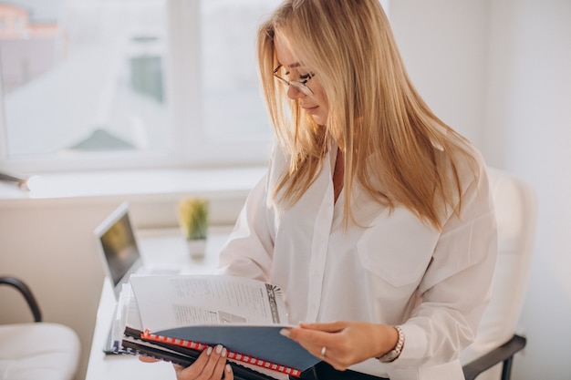 Business woman holding files at office