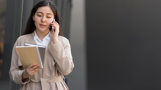 Business woman holding notebooks