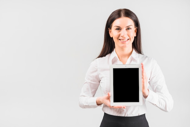 Free photo business woman holding tablet with blank screen