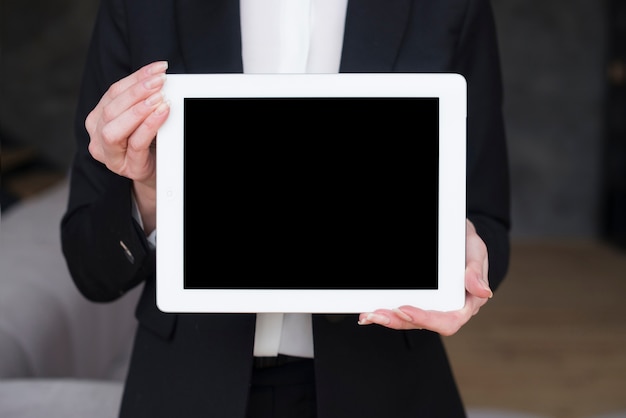 Business woman holding tablet with blank screen 