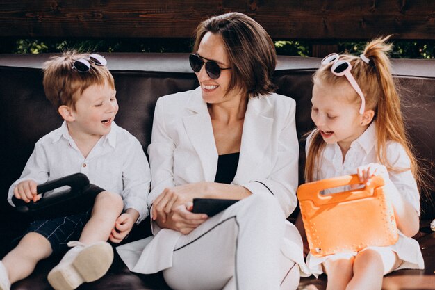 Business woman mother working from home with kids