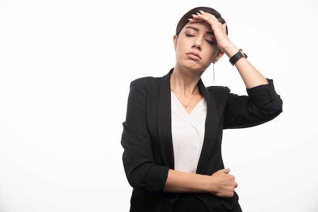 Business woman posing in suit on a white background. High quality photo