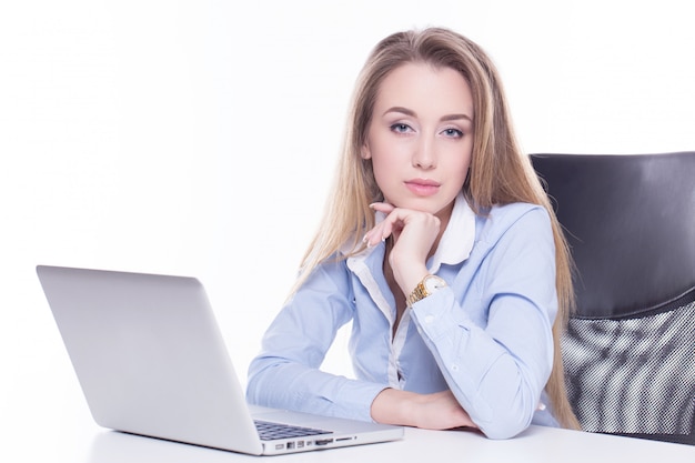 Business woman posing with a laptop