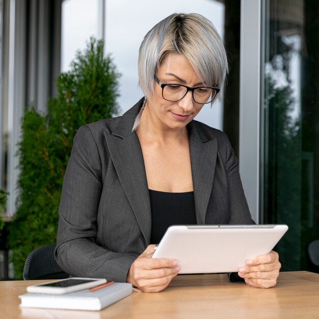 Business woman riding fron tablet mock up