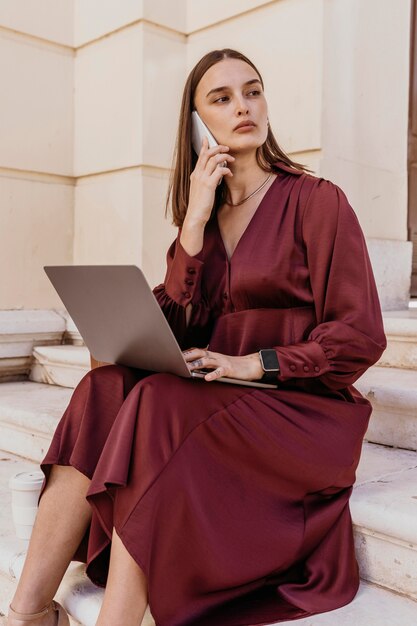 Business woman sitting on stairs