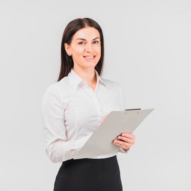 Free photo business woman standing with clipboard