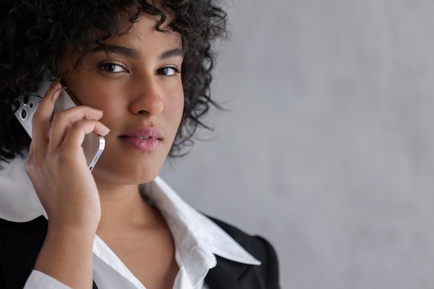 Business woman talking on phone side view