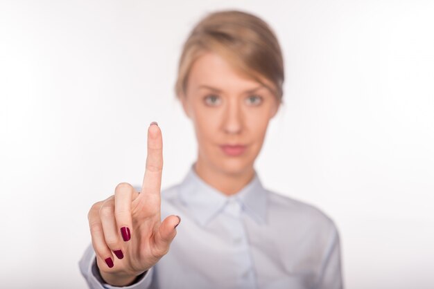 Business woman with pointing to something or touching. White bac