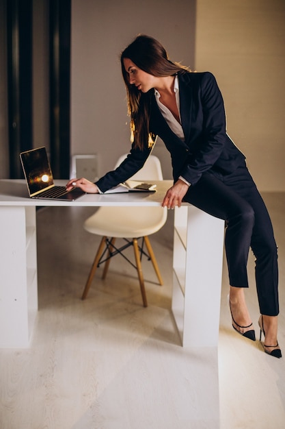 Business woman working late at night at the office