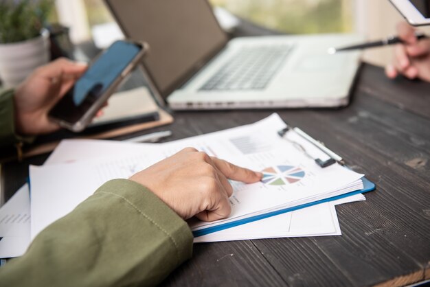 Business woman working in office with documents.