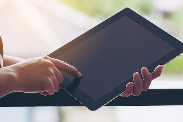 Business woman working on tablet.