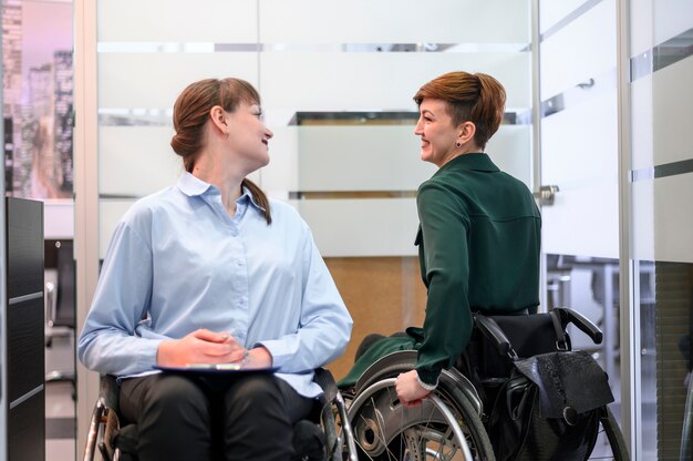 Business women in wheelchairs meeting