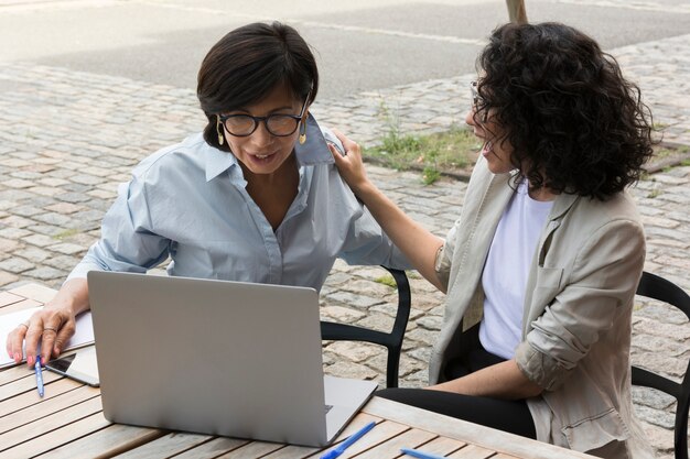 Business women working together outside