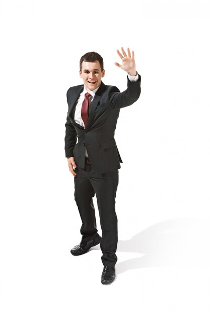 Businessman in black suit saying hello