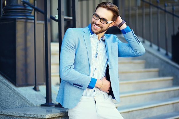 Businessman in blue suit in the street