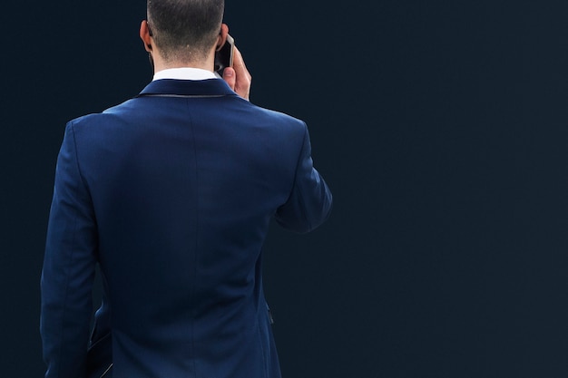 Businessman in blue suit talking on phone