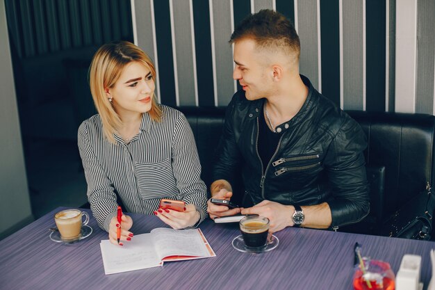 businessman and businesswoman in a cafe