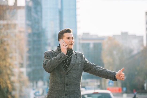 Businessman calling a taxi