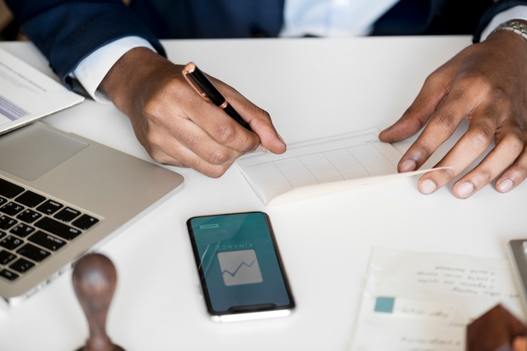 Free Photo businessman checking bankbook