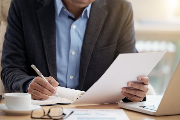 Free photo businessman checking document