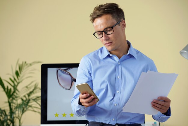 Businessman checking phone