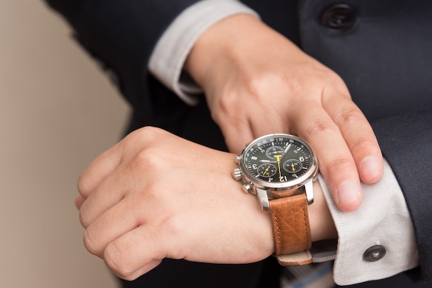 Businessman checking the time