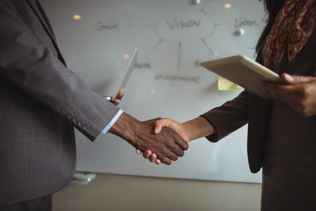 Businessman and a colleague shaking hands