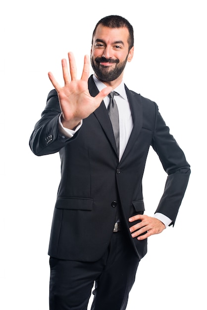 Businessman counting three