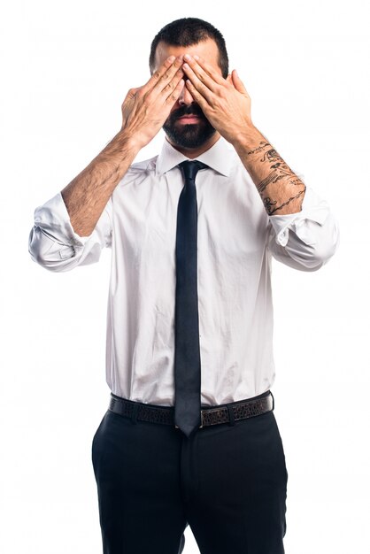 Free photo businessman covering his eyes