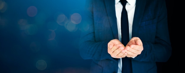 Free photo businessman cupped his hands in blue tone