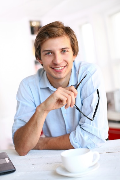 businessman at desk smiling