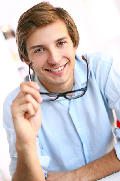 businessman at desk smiling