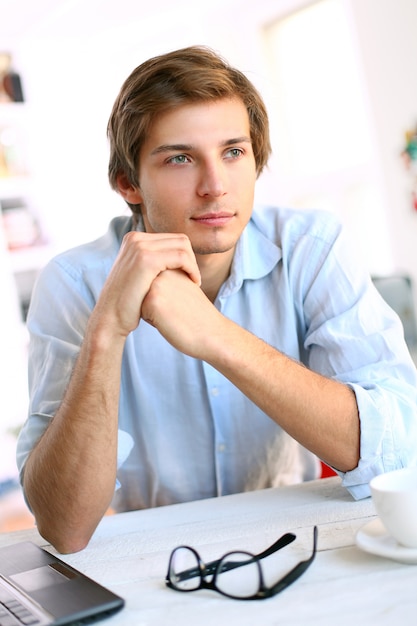 businessman at desk thinking