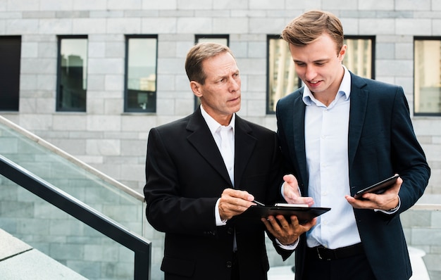 Businessman discussing near building