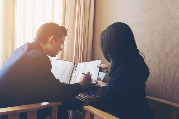 Businessman discussing with his secretary