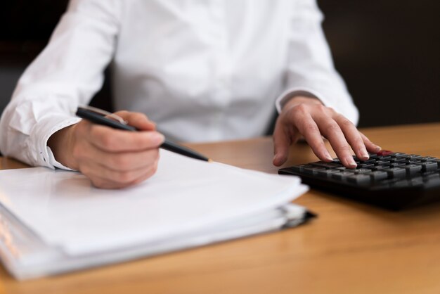 Businessman doing calculations at the office