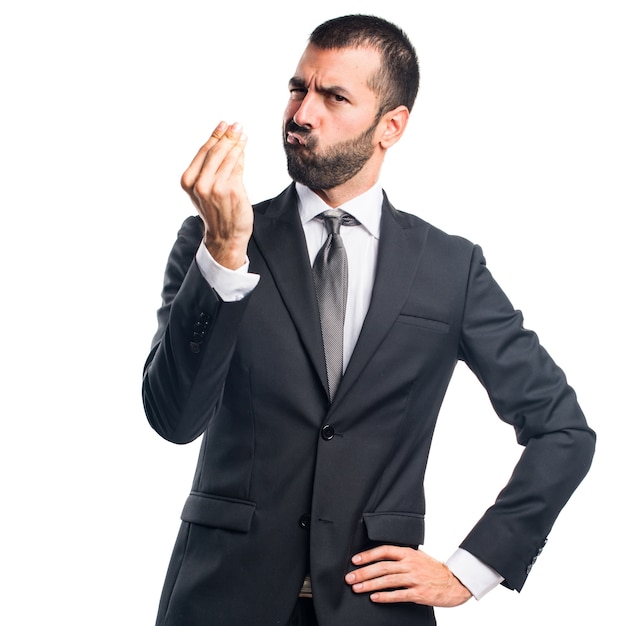 Businessman doing a money gesture