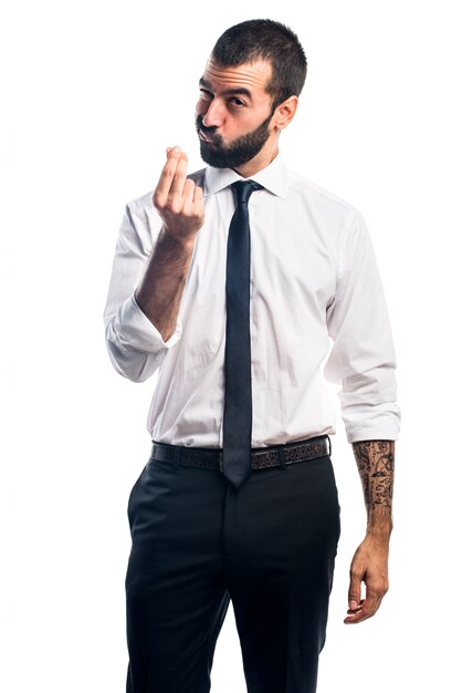 Businessman doing a money gesture