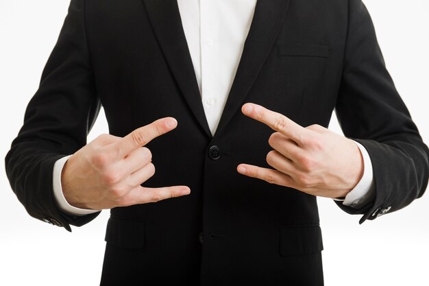 Businessman doing rock gesture