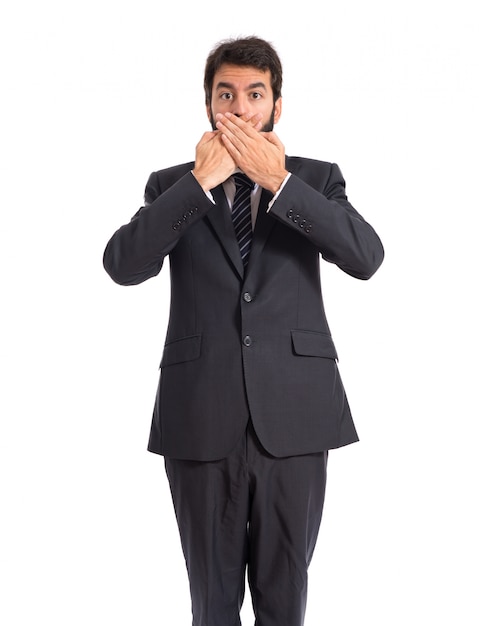 Businessman doing surprise gesture over white background