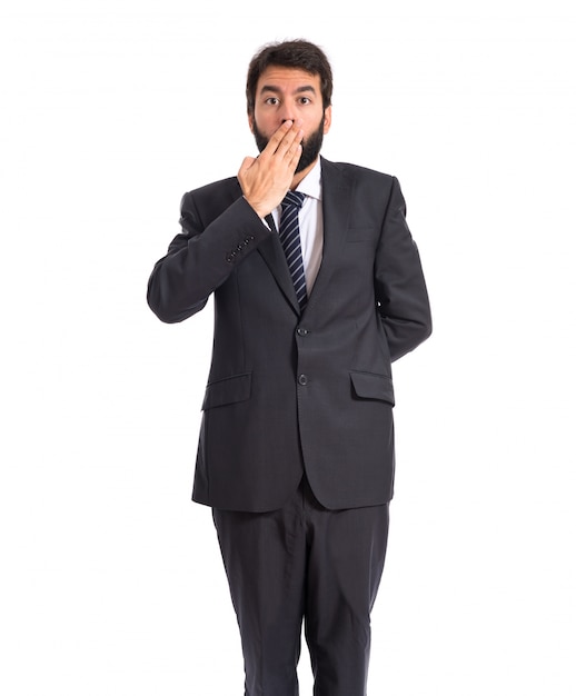 Businessman doing surprise gesture over white background