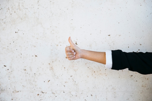 Businessman doing thumbs up gesture