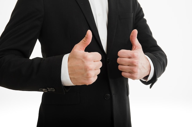Businessman doing thumbs up with both hands