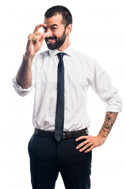 Businessman doing tiny sign