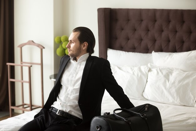 Businessman dreaming about leisure or vacation
