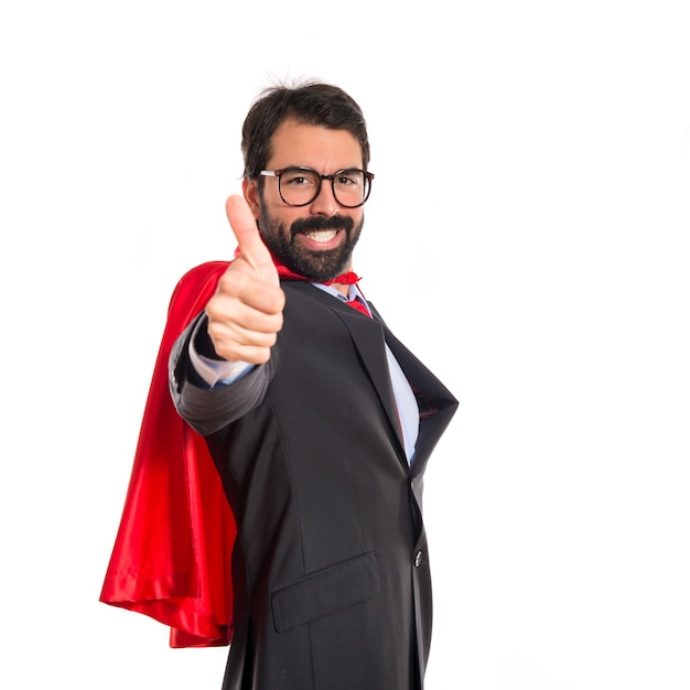 Businessman dressed like superhero with thumb up