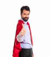 Free photo businessman dressed like superhero with thumb up